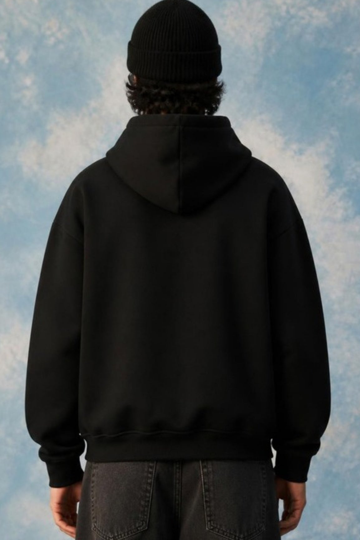 Back view of the Sleepysleve Black Double Zip Hoodie on a model