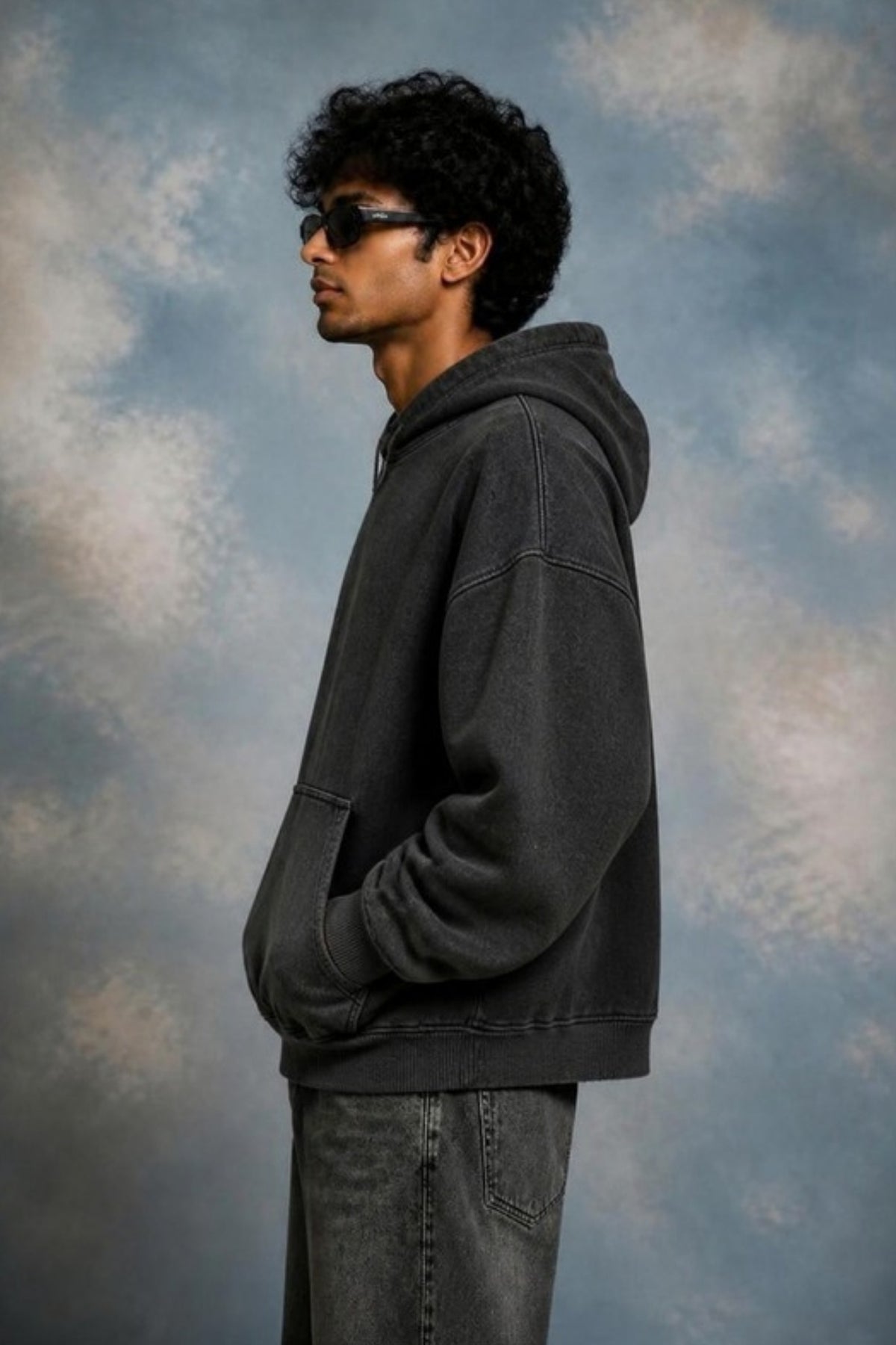 Side profile of the Sleepysleve Stone Wash Hoodie showing the boxy fit