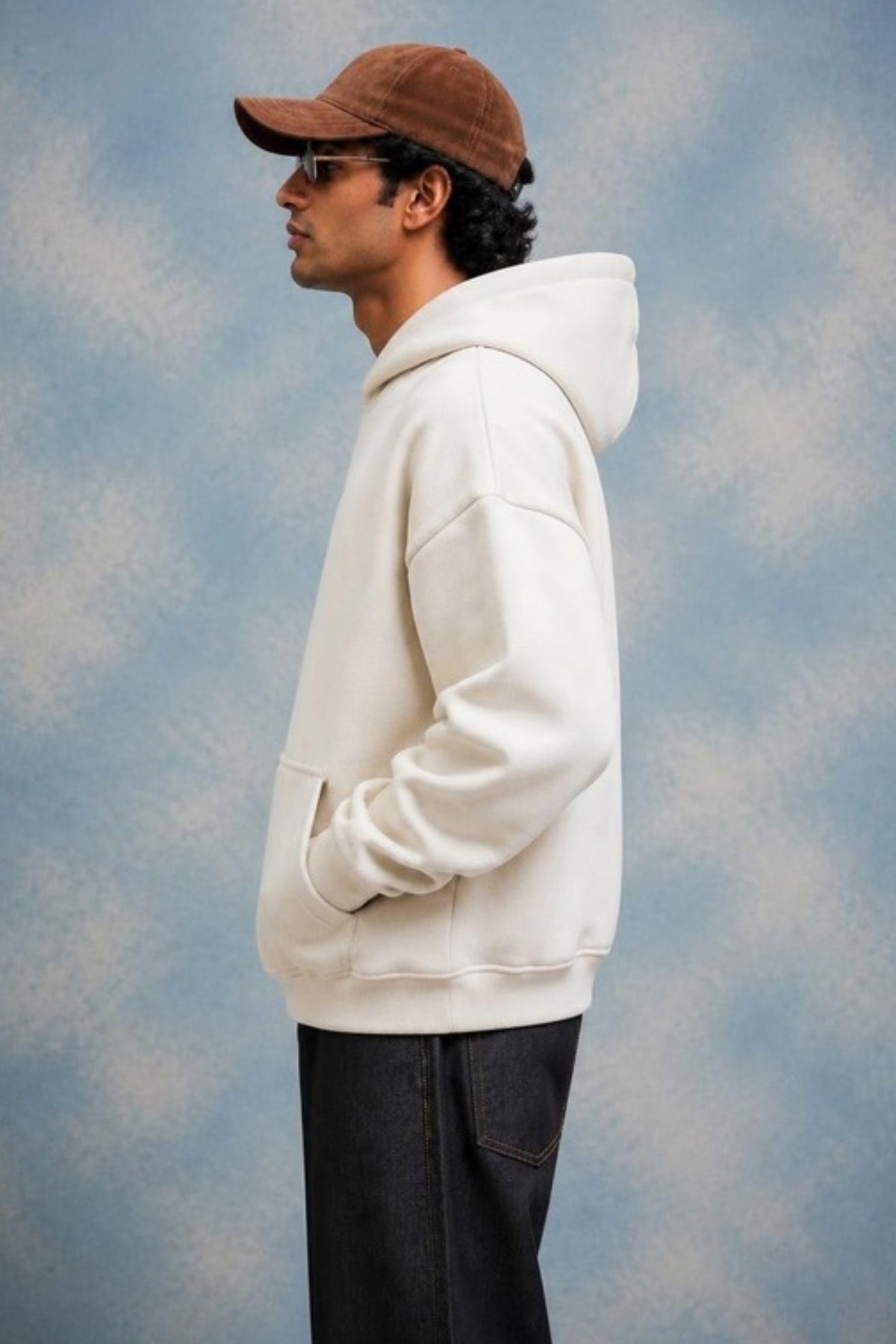 Side profile of the Sleepysleve Cream Oversized Hoodie showing the boxy fit