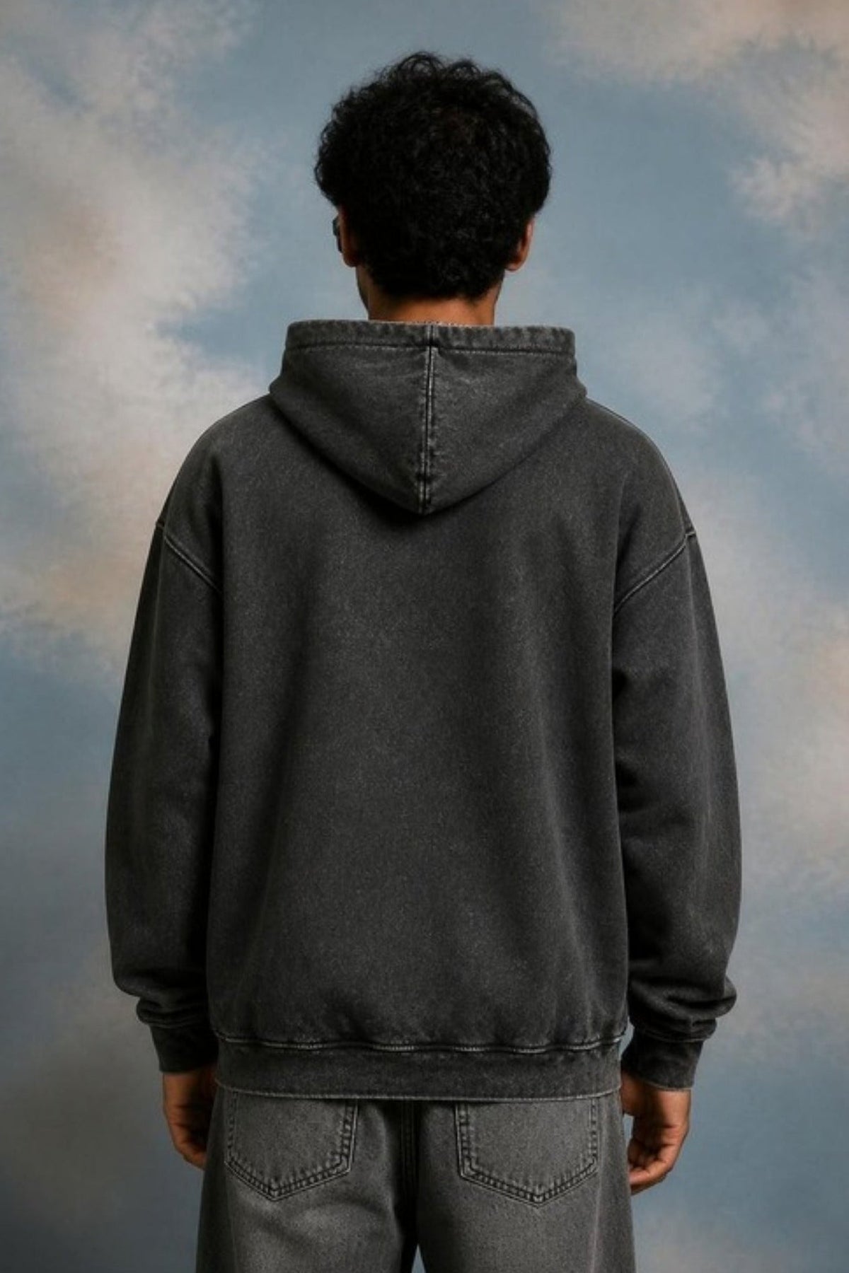 Back view of the Sleepysleve Stone Wash Hoodie on a model