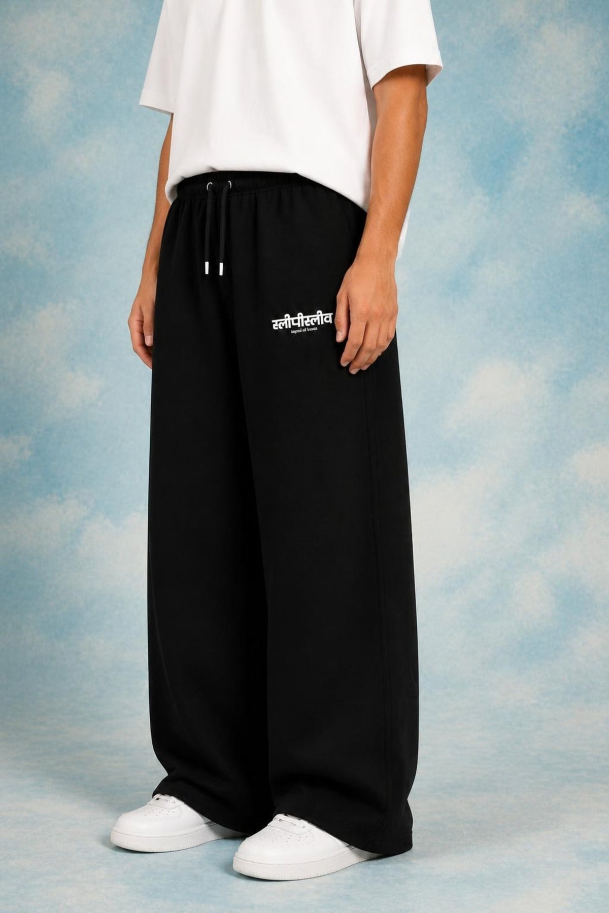 Sleepysleve black baggy sweatpant worn by a male model