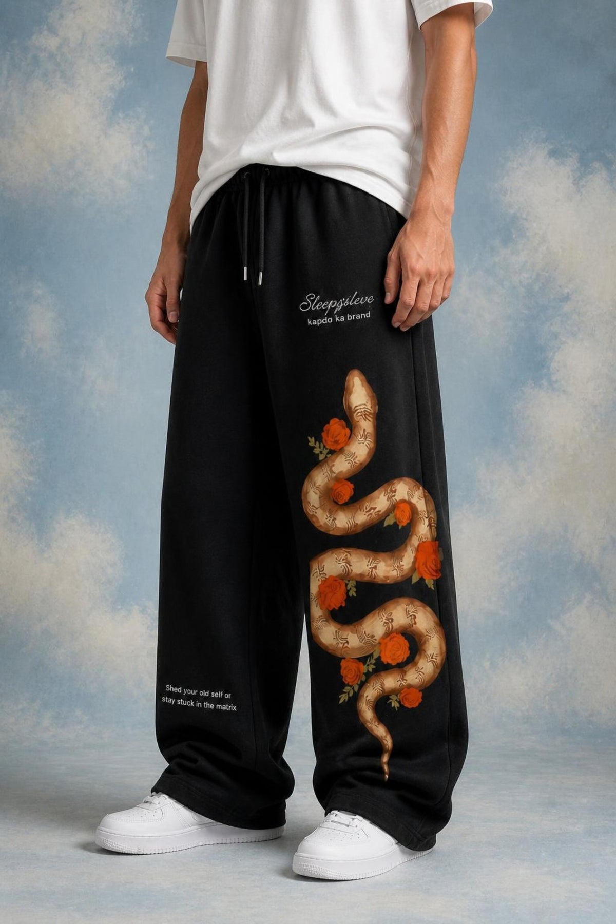 Sleepysleve Snakesleve black wide leg sweatpant with snake print, worn by a model